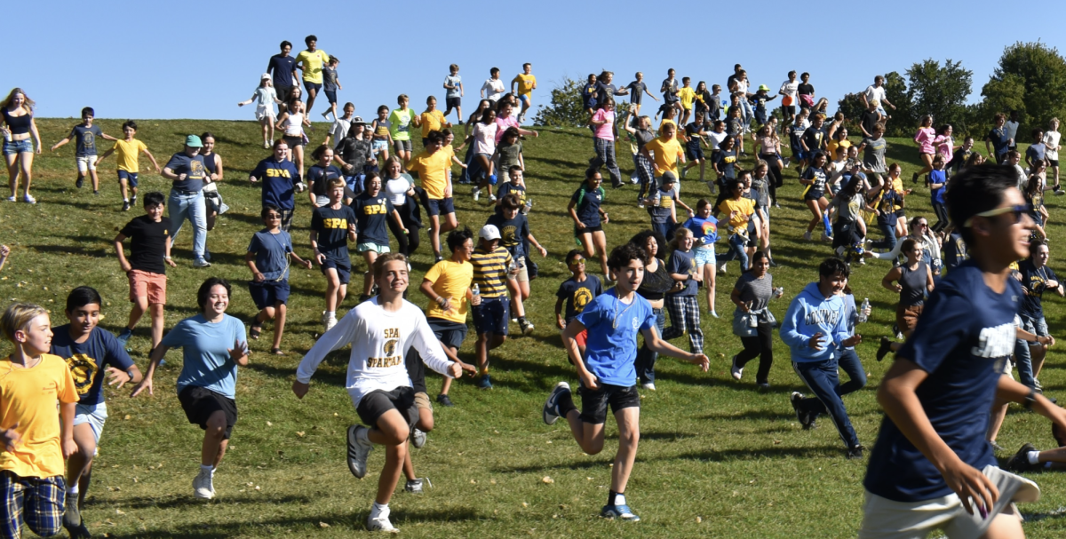 ADRENALINE. Students run next to friends or by themselves as they follow the rest of the crowd.